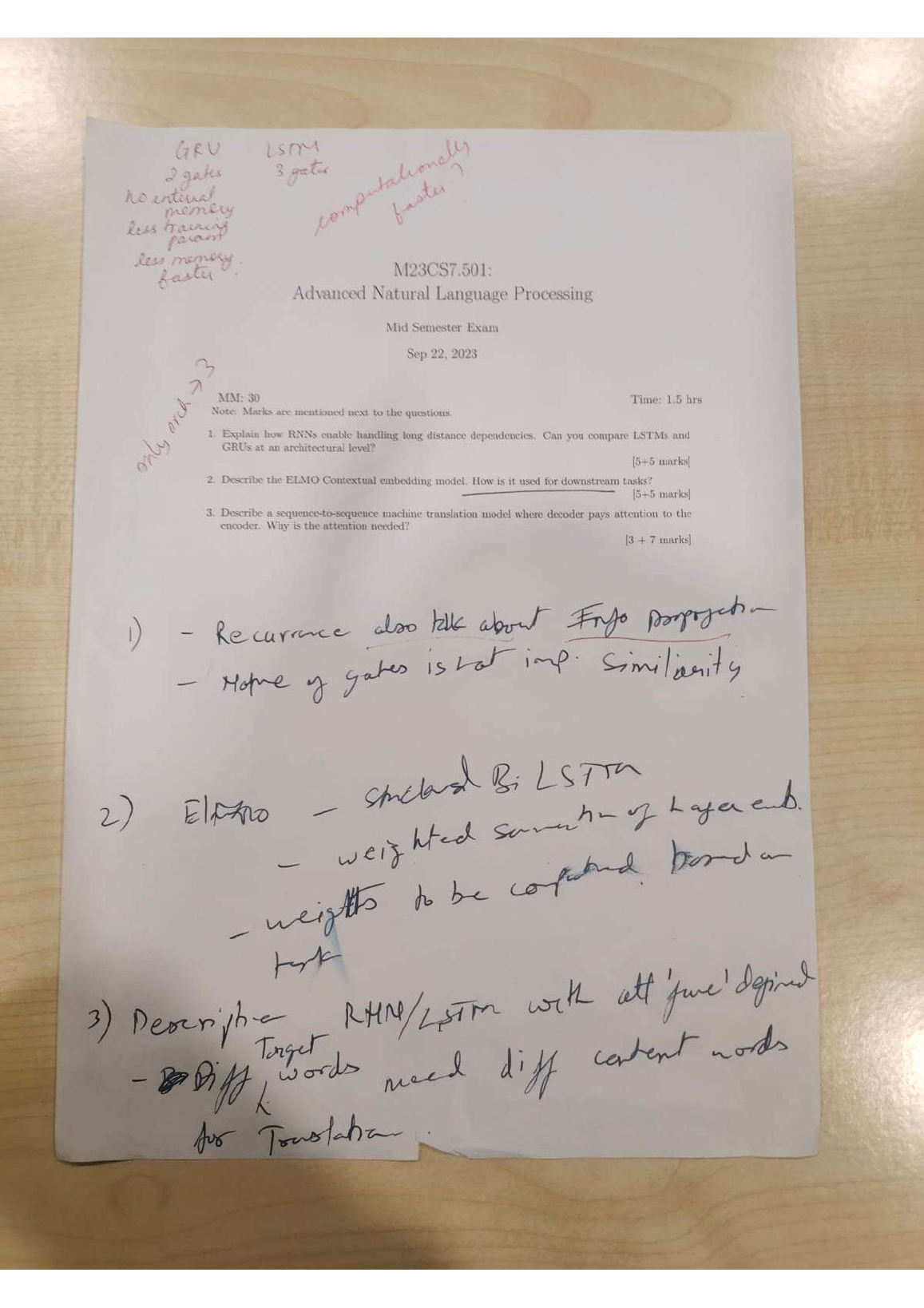 Handwritten official answer key showing marking hints for all three questions.